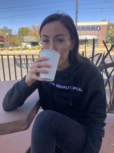 Jackie drinking latte